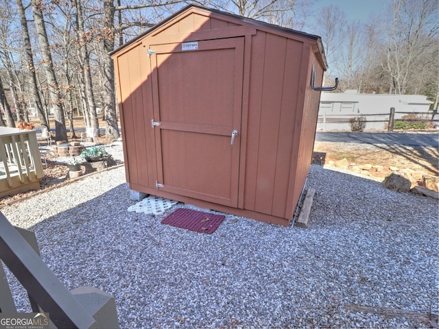 view of shed with fence