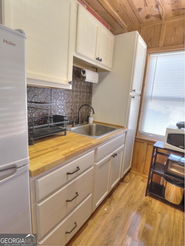 170 Tip Top Cir, Cleveland, GA 30528 - kitchen featuring wooden counters, a sink, freestanding refrigerator, white microwave, and wooden ceiling