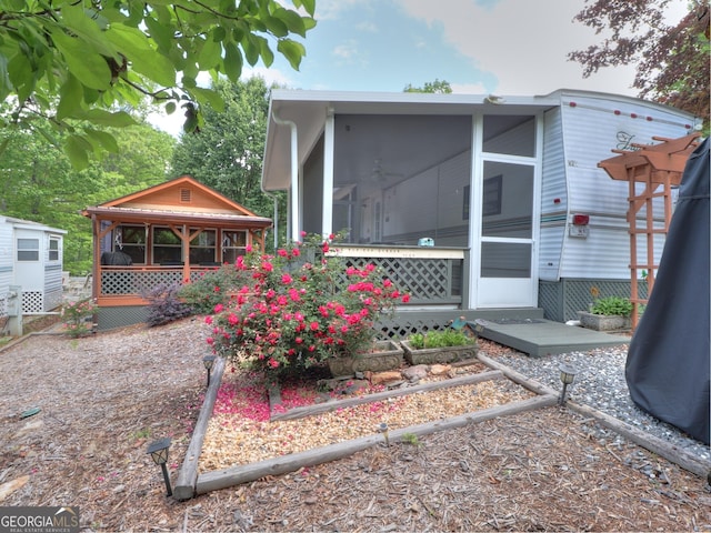 170 Tip Top Cir, Cleveland, GA 30528 - exterior space featuring a sunroom and an outdoor structure