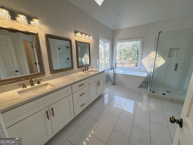 bathroom featuring tile patterned floors, vanity, independent shower and bath, and lofted ceiling