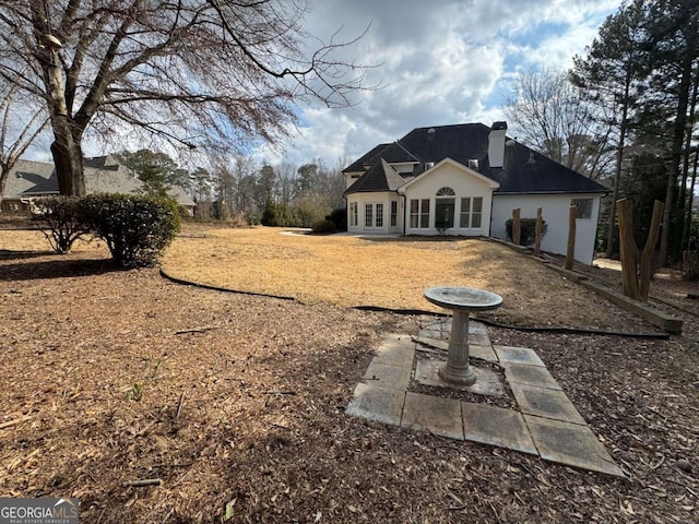 back of house featuring french doors