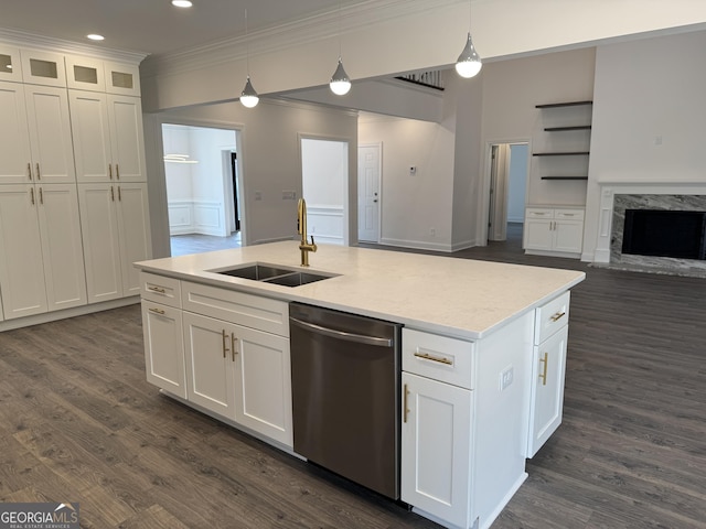 kitchen with pendant lighting, sink, stainless steel dishwasher, and white cabinets