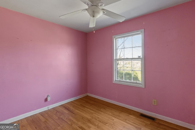 unfurnished room with ceiling fan and light wood-type flooring