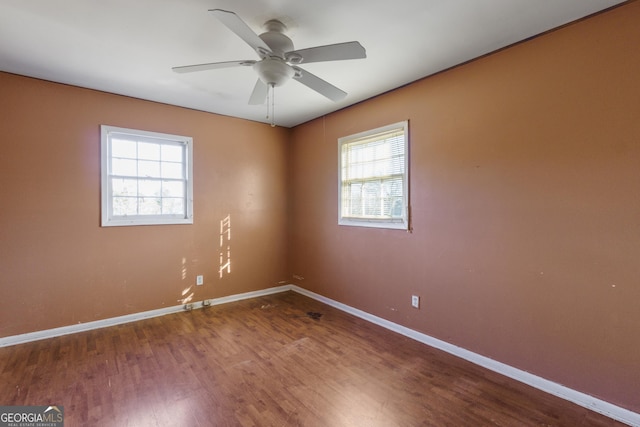 empty room featuring hardwood / wood-style flooring and ceiling fan