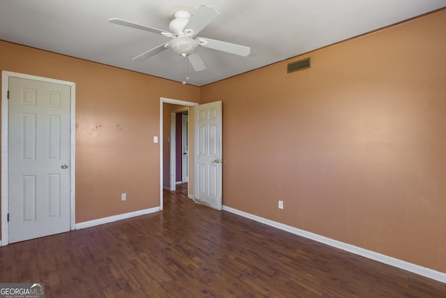 unfurnished bedroom with ceiling fan and dark hardwood / wood-style floors