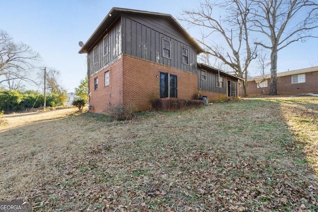 view of property exterior with a lawn