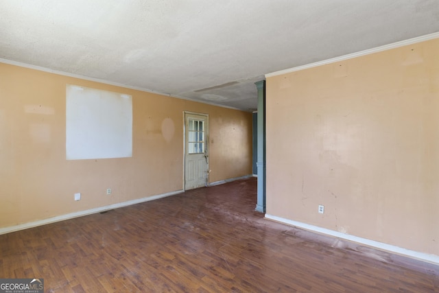 unfurnished room with crown molding, a textured ceiling, and dark hardwood / wood-style flooring