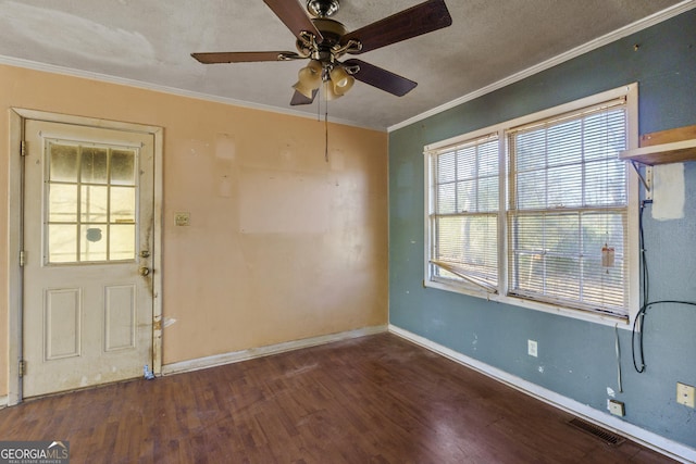 entryway featuring crown molding, dark hardwood / wood-style floors, and ceiling fan