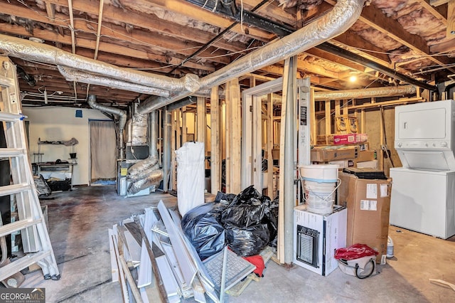 basement with stacked washer / dryer and heating unit