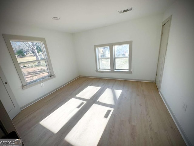 unfurnished room featuring light wood-type flooring