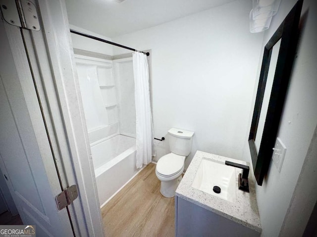 full bathroom with sink, shower / bath combo, hardwood / wood-style floors, and toilet