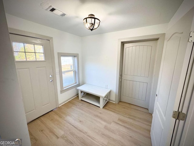 foyer entrance with light wood-type flooring