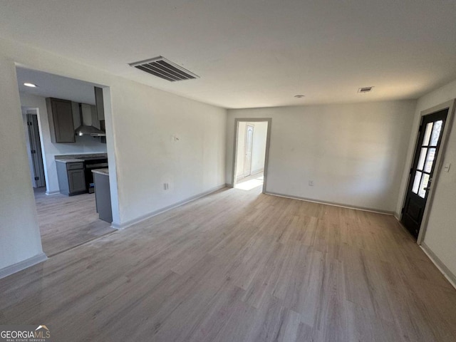 unfurnished room with light hardwood / wood-style floors