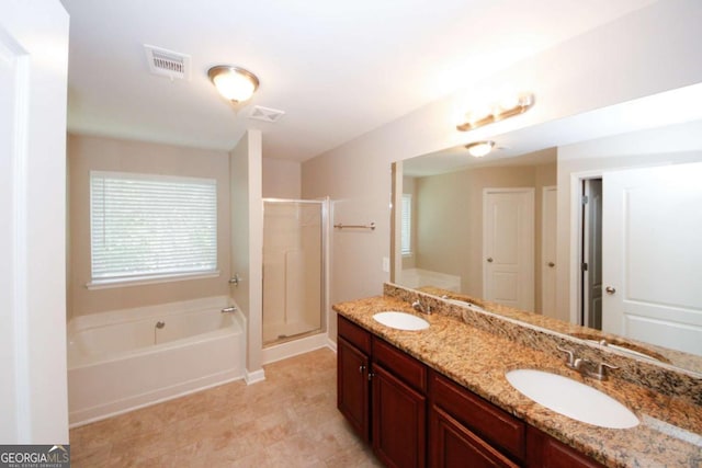 bathroom featuring vanity and separate shower and tub