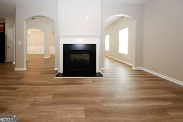 unfurnished living room with light hardwood / wood-style flooring