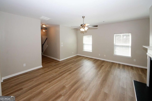 interior space featuring ceiling fan and light hardwood / wood-style flooring