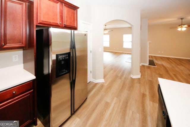 kitchen featuring ceiling fan, stainless steel fridge with ice dispenser, and light hardwood / wood-style flooring