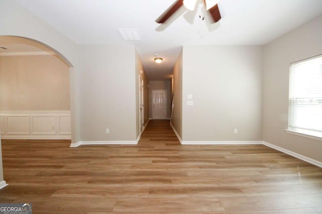 empty room featuring ceiling fan and light hardwood / wood-style floors