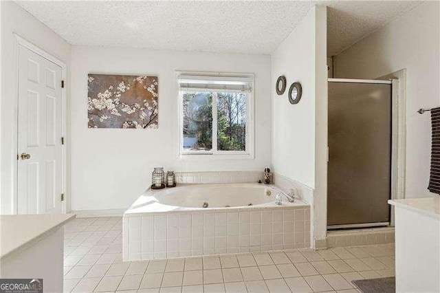 full bathroom featuring a stall shower, tile patterned flooring, and a whirlpool tub