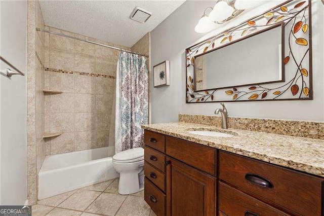 full bath featuring toilet, shower / bath combo with shower curtain, a textured ceiling, vanity, and tile patterned floors