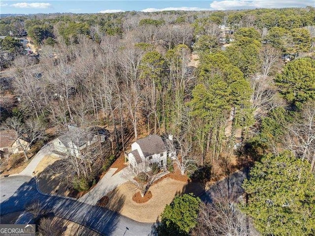 aerial view with a wooded view