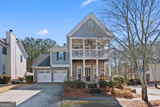 view of front of property with a garage, a balcony, and a porch