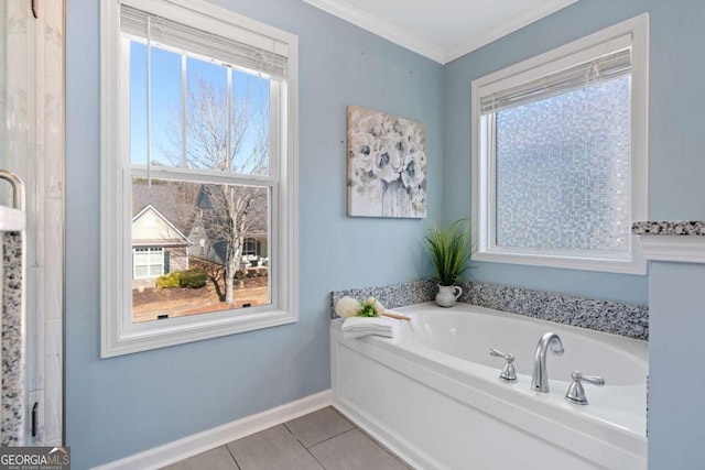 bathroom featuring crown molding, a bathing tub, and tile patterned flooring