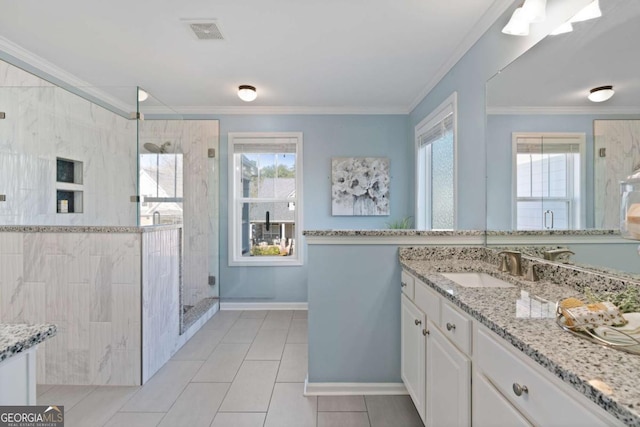 bathroom featuring walk in shower, ornamental molding, tile patterned flooring, and vanity