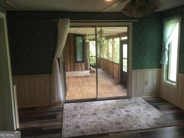 doorway to outside with hardwood / wood-style floors, a wealth of natural light, and ceiling fan