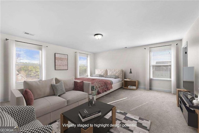 bedroom featuring light colored carpet