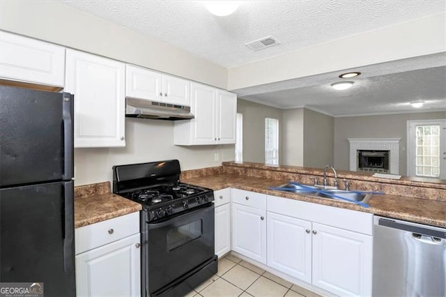 kitchen featuring white cabinetry, kitchen peninsula, sink, and black appliances