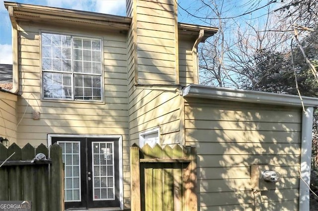 view of side of property featuring french doors