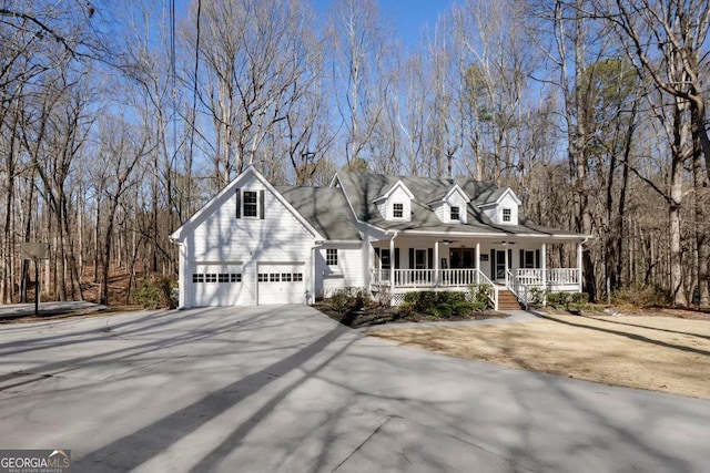 cape cod-style house featuring a porch and a garage