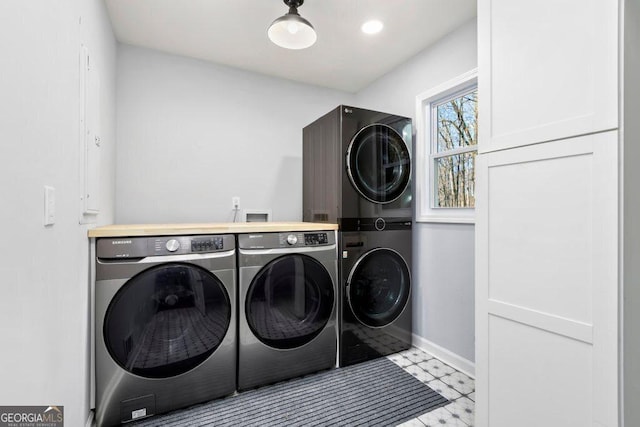 laundry room featuring stacked washer / dryer