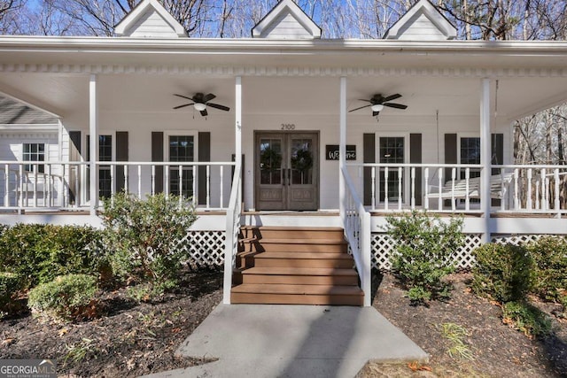 entrance to property with french doors, ceiling fan, and a porch