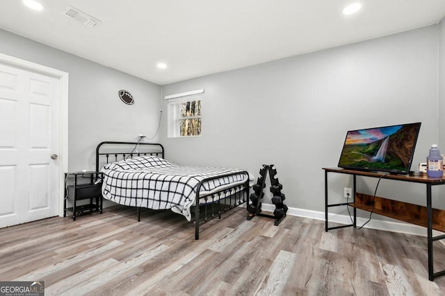 bedroom with light hardwood / wood-style flooring