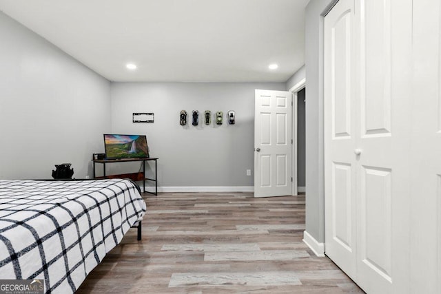 bedroom with light wood-type flooring