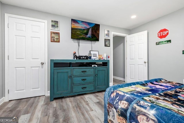 bedroom with light hardwood / wood-style flooring