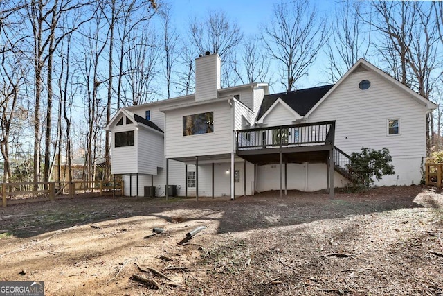 rear view of property with a deck and central air condition unit