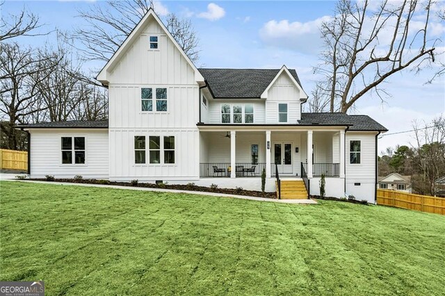 view of front of home with a front lawn and a porch