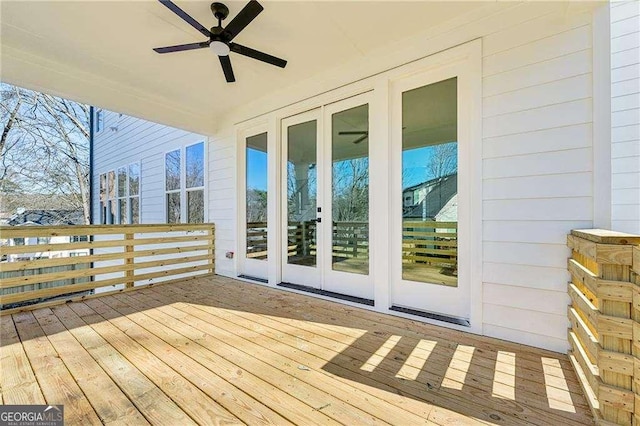 wooden deck featuring french doors and ceiling fan