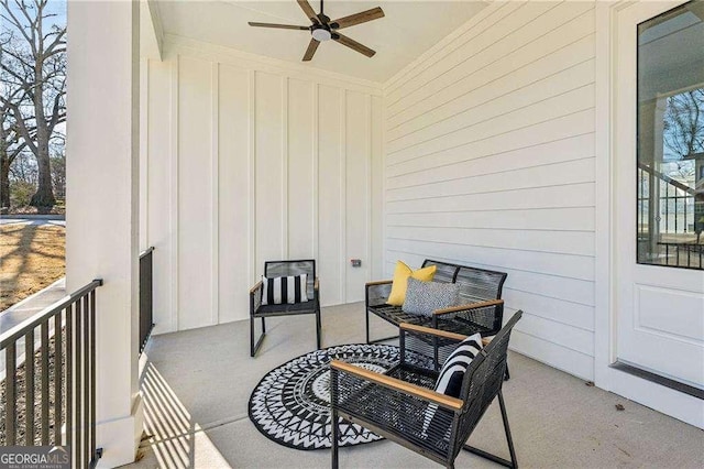 balcony with a porch and ceiling fan