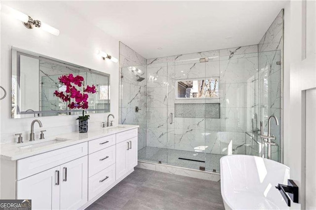 bathroom with shower with separate bathtub and vanity