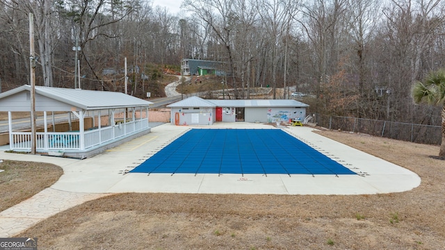 view of swimming pool with a patio