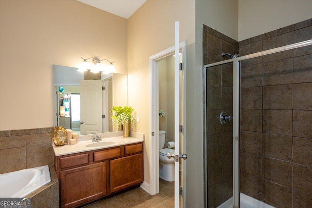 full bathroom with vanity, toilet, tile patterned flooring, and plus walk in shower