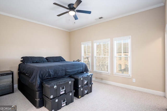 bedroom featuring crown molding, light colored carpet, and ceiling fan