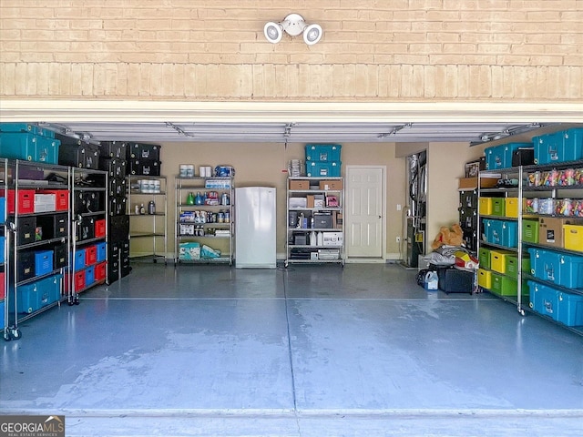 garage with white fridge