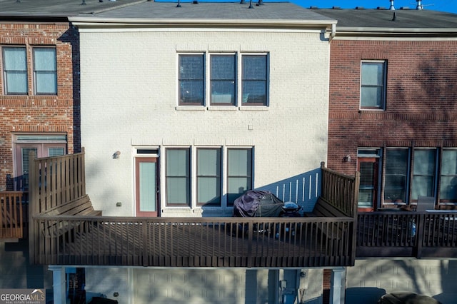 rear view of house featuring a balcony