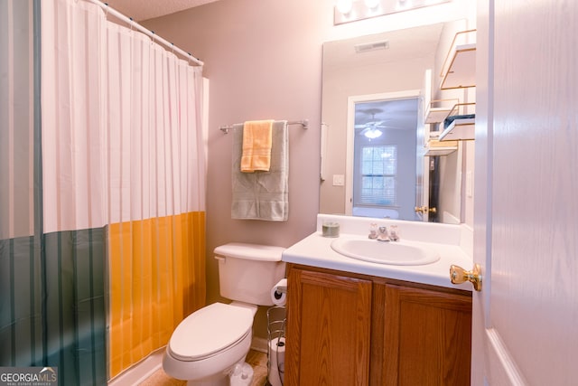 bathroom with visible vents, toilet, vanity, and a shower with curtain