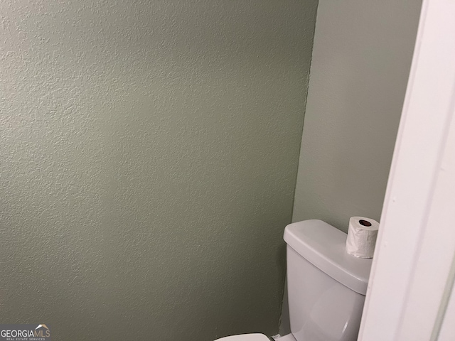 bathroom featuring toilet